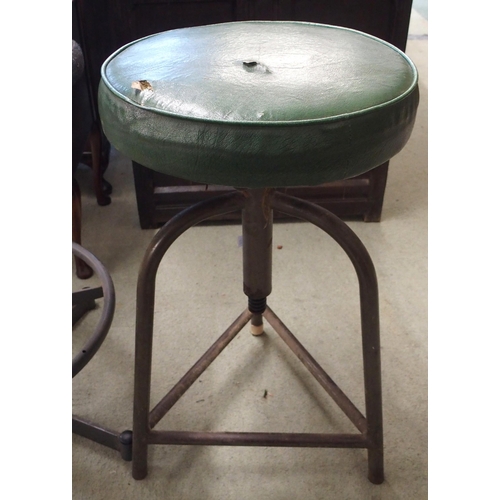 121 - A 20th century adjustable machinists stool with upholstered back and seat and another machinists sto... 