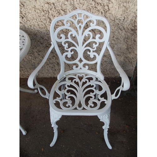 124 - A 20th century white painted cast metal garden table and two chairs (3)