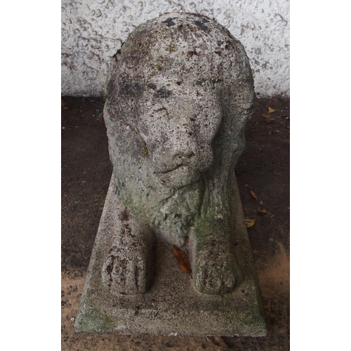 126 - A 20th century stoneware garden statue of a lion passant, 35cm high x 65cm long x 26cm wide