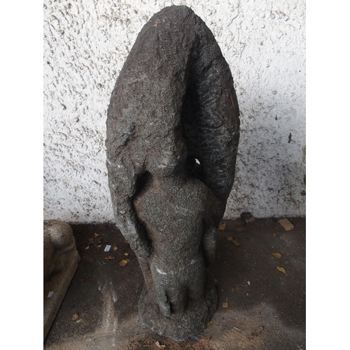 127 - A 20th century unfinished carved stone garden statue of a couple in embrace and a stoneware birdbath... 