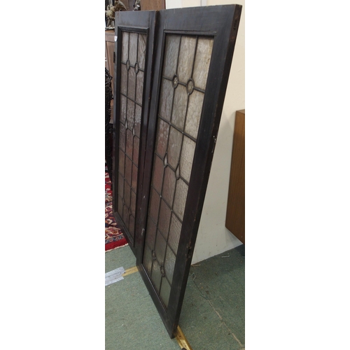 130 - A lot of two leaded stained glass panels, 116cm high x 45cm wide (2)