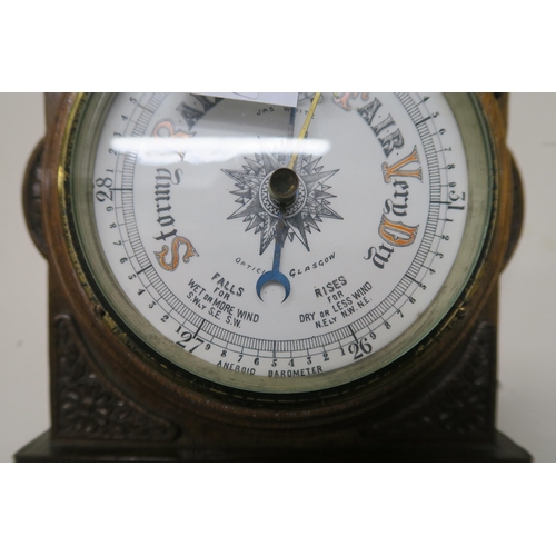 5 - A 20th century carved oak barometer/thermometer and brass framed circular wall mirror (2)