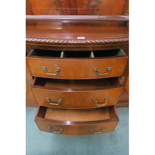 64 - A 20th century mahogany serpentine front sideboard with three central drawers flanked by cabinet doo... 