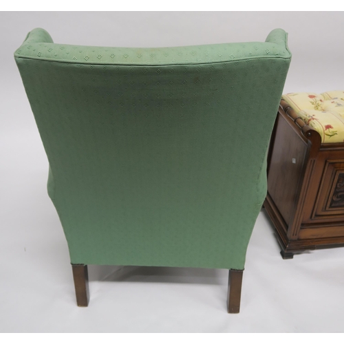 81 - A 20th century wing back armchair and an upholstered piano stool (2)