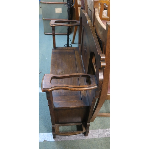 82 - A 20th century oak hall seat with umbrella stand arms and a contemporary metal standard lamp (2)