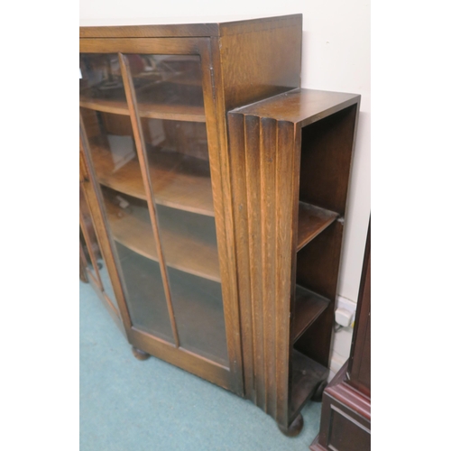 95 - An early 20th century Art Deco glazed two door bookcase with open bookcase ends, 112cm high x 122cm ... 