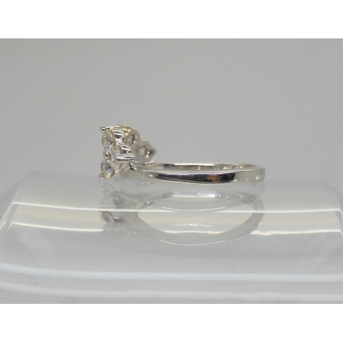 713 - A 14k white gold Leo diamond companion ring,designed to fit snuggly with solitaire diamond rings, an... 
