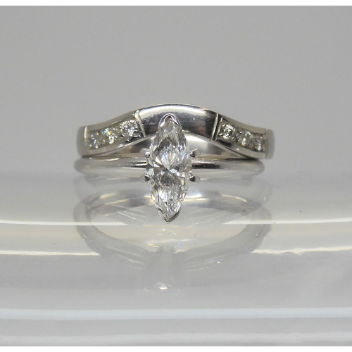 714 - A 14k white gold 0.55ct marquis diamond solitaire ring, finger size K1/2, together with a companion ... 
