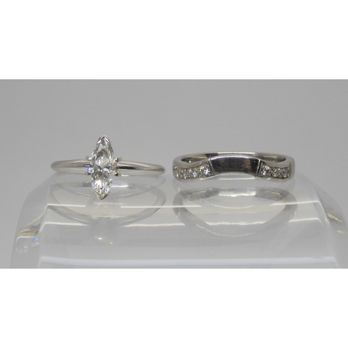 714 - A 14k white gold 0.55ct marquis diamond solitaire ring, finger size K1/2, together with a companion ... 