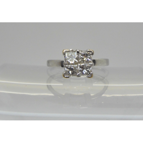 719 - An 18ct white gold four princess cut diamond cluster ring, set with estimated approx 0.80cts of diam... 