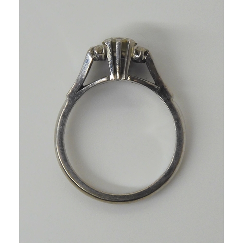 721 - An 18ct white gold retro diamond ring, set with an estimated approx 0.50ct diamond with further diam... 