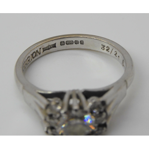 721 - An 18ct white gold retro diamond ring, set with an estimated approx 0.50ct diamond with further diam... 
