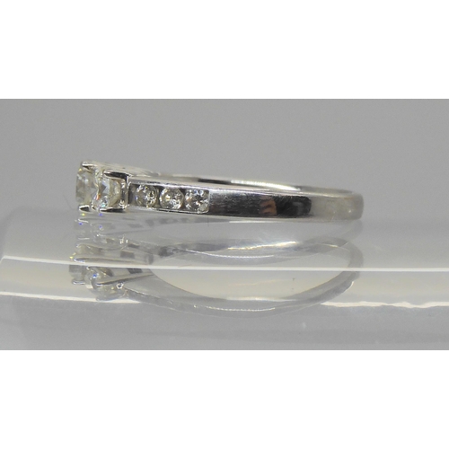 723 - A three stone diamond ring, set with estimated approx 0.80cts of brilliant cut diamonds the three ma... 