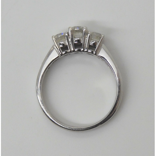 723 - A three stone diamond ring, set with estimated approx 0.80cts of brilliant cut diamonds the three ma... 