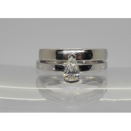 727 - An unusual pear shaped diamond solitaire ring, set with an estimated approx 0.33ct pear shaped diamo... 