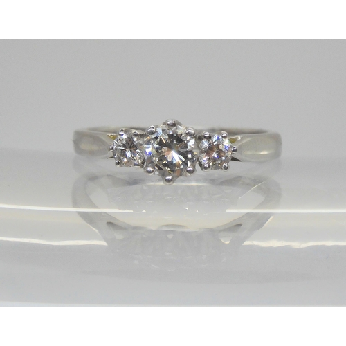 729 - An 18ct white gold classic three stone diamond ring, set with estimated approx 0.40cts combined, fin... 