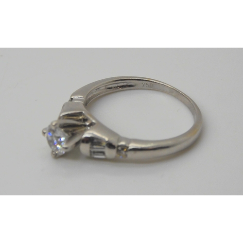 734 - An 18ct white gold prong set diamond solitaire, of estimated approx 0.33cts, with further baguette a... 