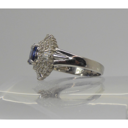 737 - A platinum sapphire and diamond cluster ring, the sapphire measures approx 6.6mm x 5.5mm x 3.2mm, fu... 