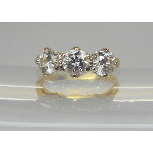A substantial 18ct gold three stone diamond ring, set with estimated approx 1.70cts of brilliant cut diamonds, finger size K1/2, weight 3.8gms