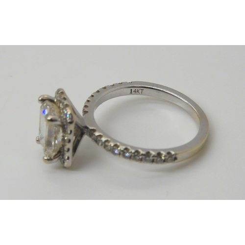 741 - A 14k white gold substantial diamond ring, set with an estimated approx 1.40ct step cut diamond, wit... 