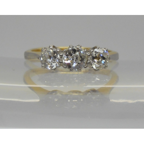 746 - An 18ct yellow gold and platinum three stone diamond ring set with estimated approx 0.75cts of old c... 
