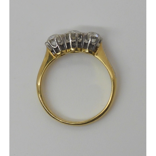 746 - An 18ct yellow gold and platinum three stone diamond ring set with estimated approx 0.75cts of old c... 