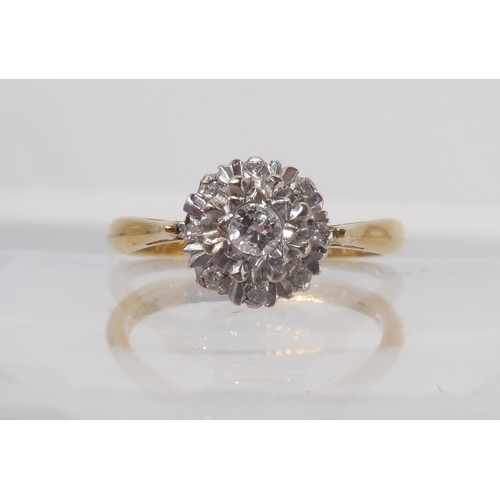 747 - An 18ct gold diamond cluster , set with estimated approx 0.15cts of brilliant cut diamonds, finger s... 
