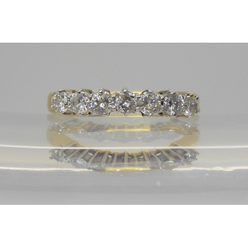 749 - An 18ct gold seven stone diamond ring, set with estimated approx 0.75cts of brilliant cut diamonds, ... 