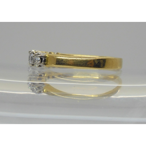 749 - An 18ct gold seven stone diamond ring, set with estimated approx 0.75cts of brilliant cut diamonds, ... 