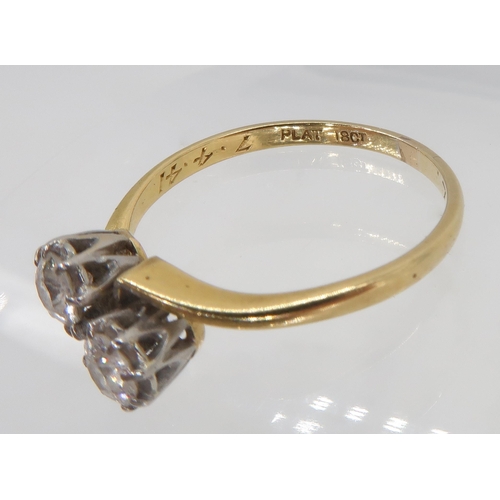 754 - A vintage 18ct and platinum twin stone diamond ring, set with estimated approx 0.40cts of old cut di... 