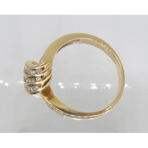 755 - An 18ct gold diamond set twist ring, set with estimated approx 0.40cts of brilliant cut diamonds, si... 
