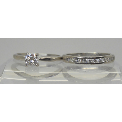757 - A platinum prong set diamond solitaire, of estimated approx 0.50cts, finger size M, together with a ... 