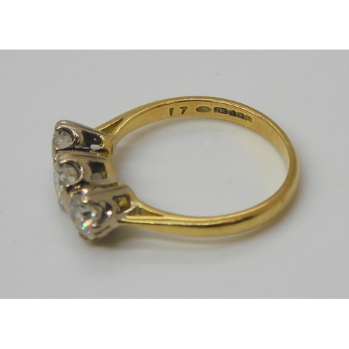 758 - An 18ct gold three stone diamond ring, set with estimated approx 1ct of brilliant cut diamonds. Fing... 
