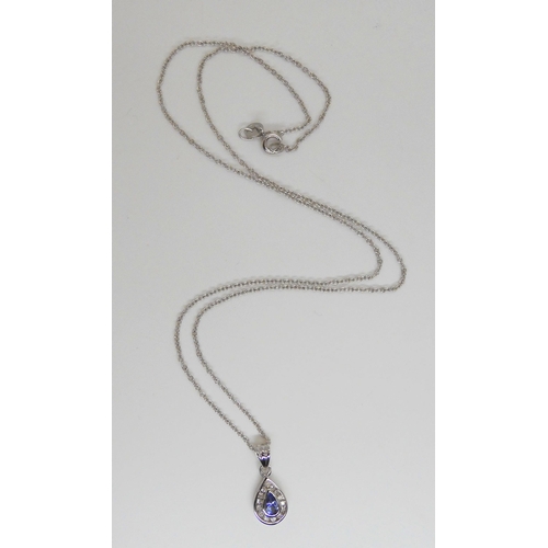 765 - An 18ct white gold diamond and tanzanite pendant, on a 9ct white gold chain, length 46cm, weight 2.7... 