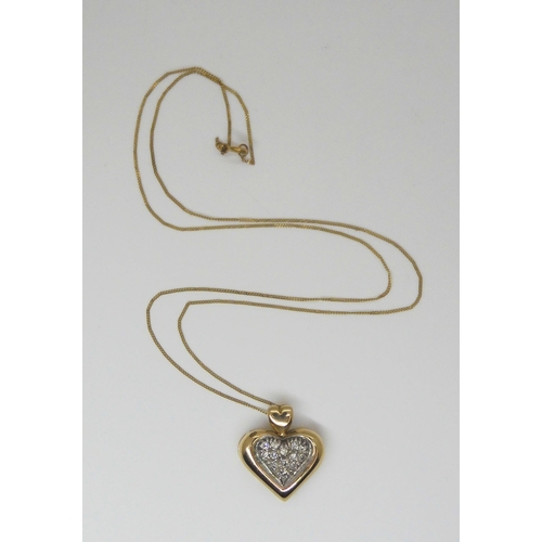 769 - A 9ct gold diamond set heart pendant and chain, set with estimated approx 0.23cts of brilliant cut d... 