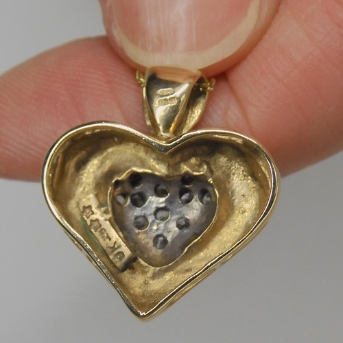 769 - A 9ct gold diamond set heart pendant and chain, set with estimated approx 0.23cts of brilliant cut d... 