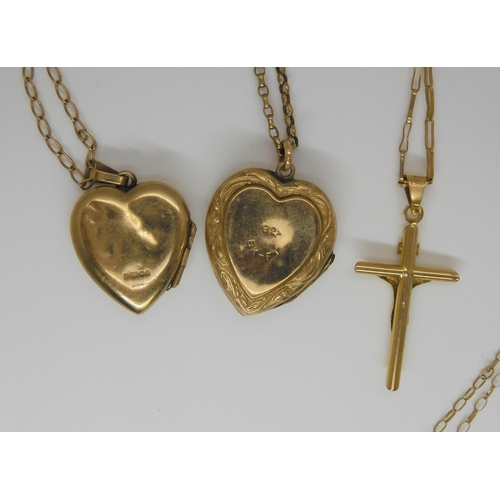 776 - A 9ct gold cross on chain, a 9ct front and back heart shaped lock on 9ct chain, a 9ct heart shaped l... 
