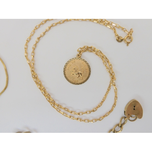784 - A 9ct gold charm bracelet with seven charms, a 9ct Leo pendant on chain, and an 18ct gold M pendant ... 