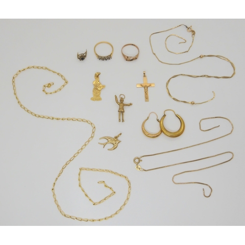 789 - A collection of 9ct gold and yellow metal items including policeman charm, cross pendant, swallow pe... 