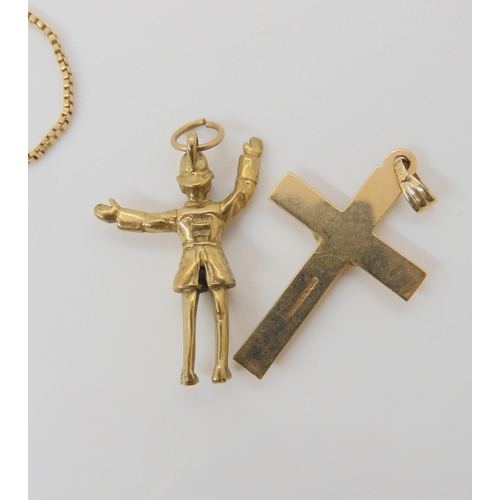 789 - A collection of 9ct gold and yellow metal items including policeman charm, cross pendant, swallow pe... 