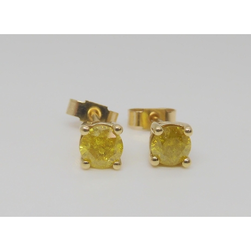 796 - A 9ct gold mounted yellow diamond pendant, together with a pair of matching earrings, all approx. 0.... 