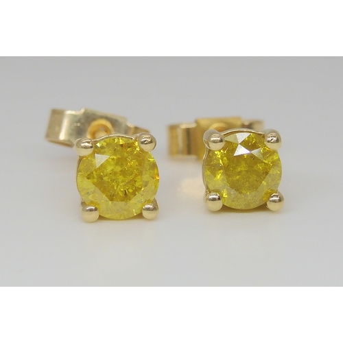 796 - A 9ct gold mounted yellow diamond pendant, together with a pair of matching earrings, all approx. 0.... 