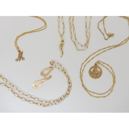 800 - A collection of 9ct chains and pendants, weight together 25.6gms