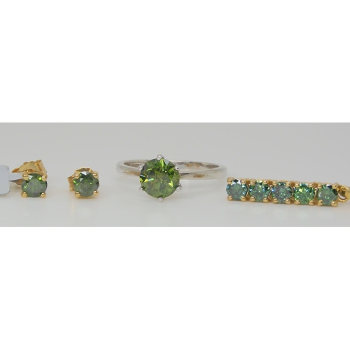 811 - A 9ct white gold green diamond set solitaire ring, approx. 1ct, a pair of matching earrings in yello... 