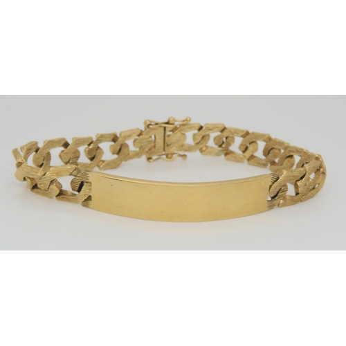 822 - A gentleman's 9ct textured link ID bracelet, 29.5gms