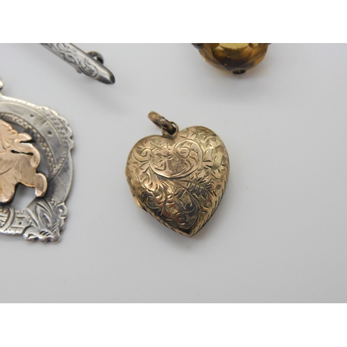 857 - Two silver chess medallions, a yellow metal heart shaped locket, a large marcasite brooch and other ... 