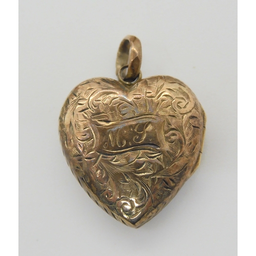 857 - Two silver chess medallions, a yellow metal heart shaped locket, a large marcasite brooch and other ... 