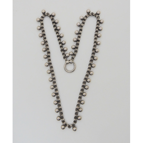 884 - A Victorian white metal locket, ball chain