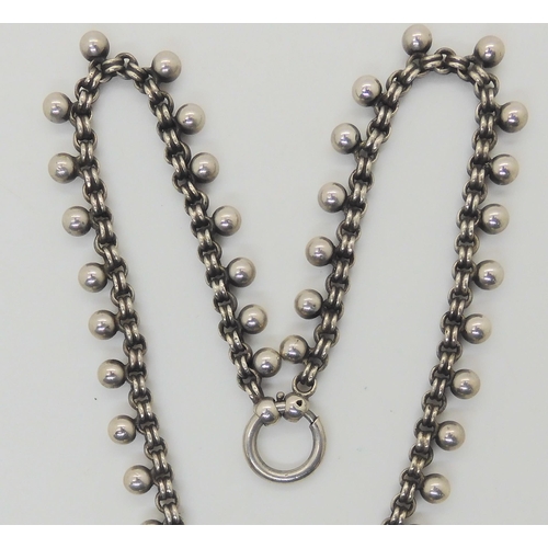 884 - A Victorian white metal locket, ball chain