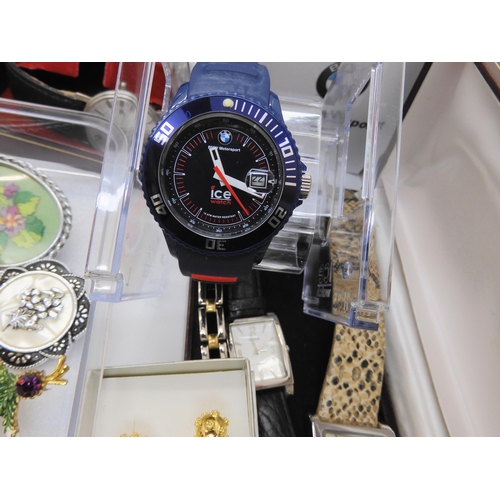 899C - A large collection of costume jewellery and watches to include a BMW ICE watch, in original packagin... 